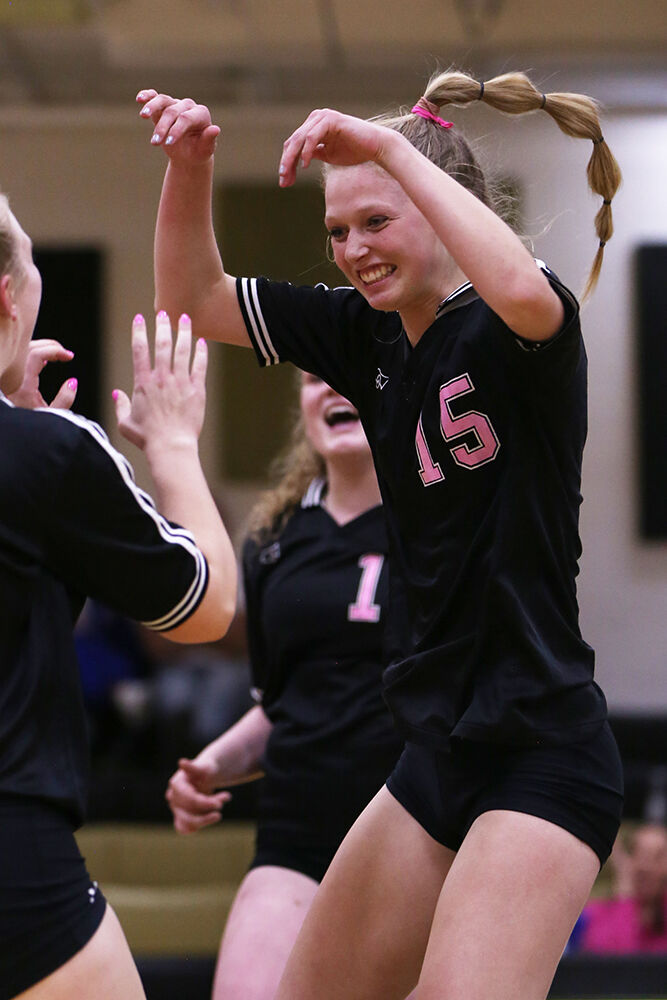 Anatefka Webber jumps up in the air in celebration of a kill during the fifth set
